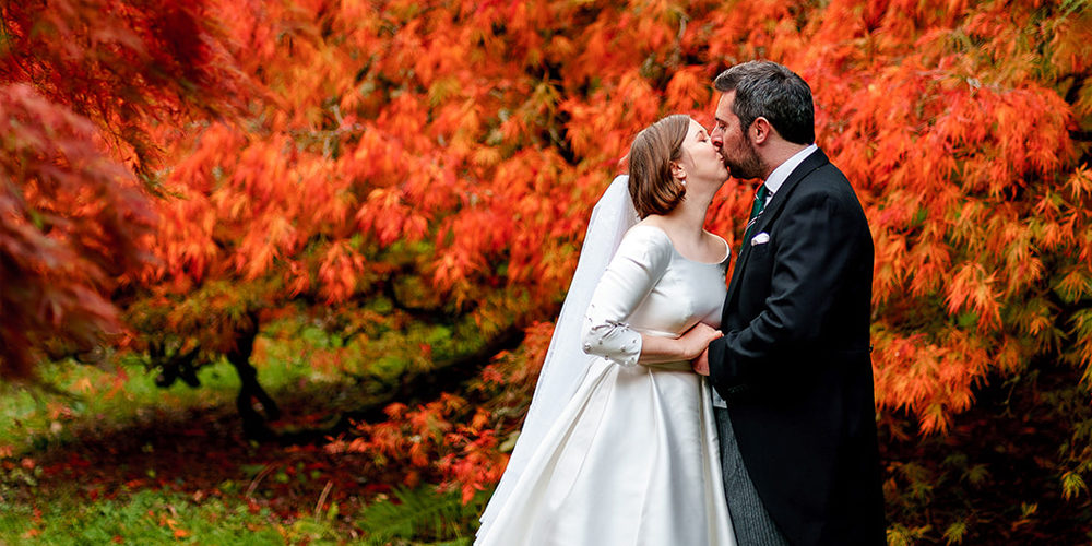Wedding photo with an autumn backdrop
