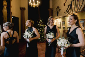 Bridesmaids waiting for the bride at Ramster Hall during a Christmas wedding venue celebration