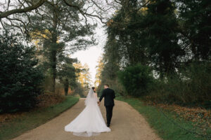 Newlyweds in the winter gardens at Ramster Hall wedding venue in Surrey