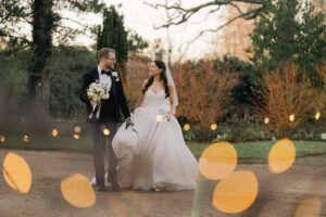 Newlyweds in the winter gardens at Ramster Hall country house wedding venue