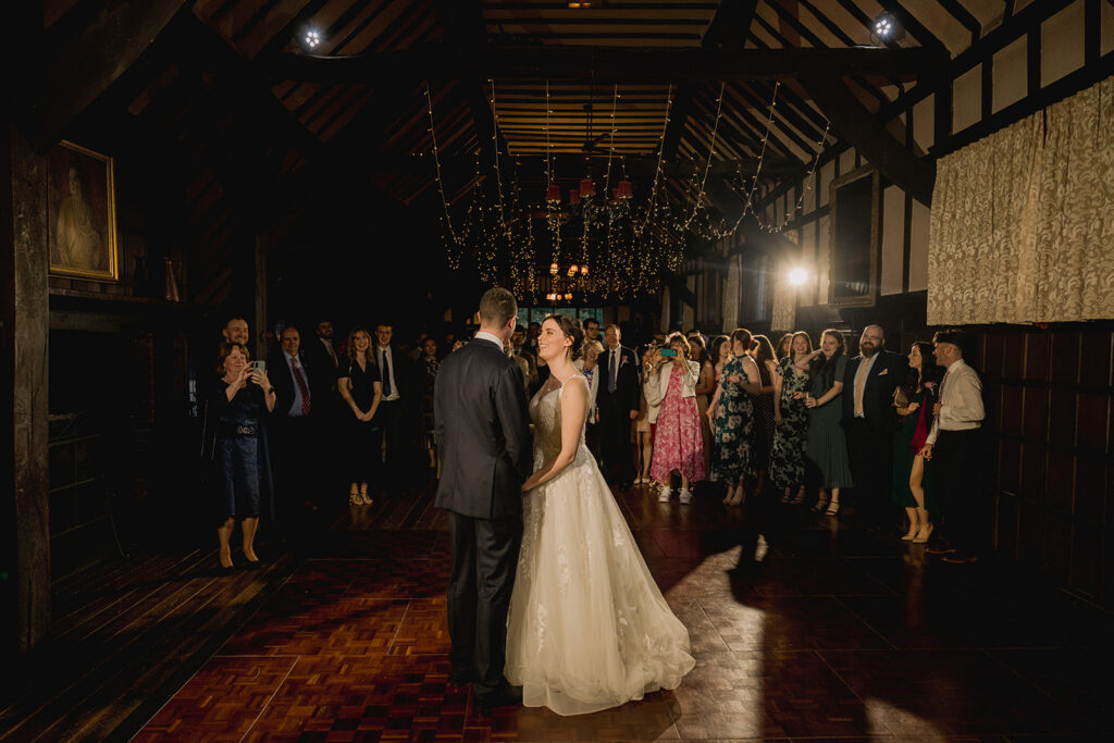 First dance by the bride and groom at a Surrey wedding venue with a dance floor.